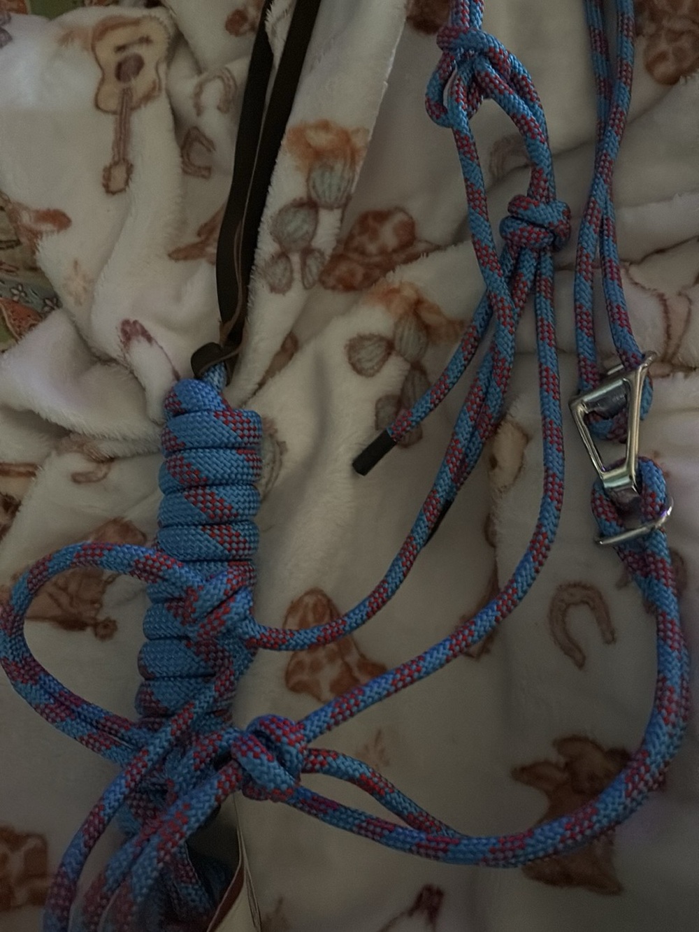 Two brand new rope halters and a tack set